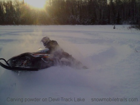 Devil Track Lake powder snowmobiling
