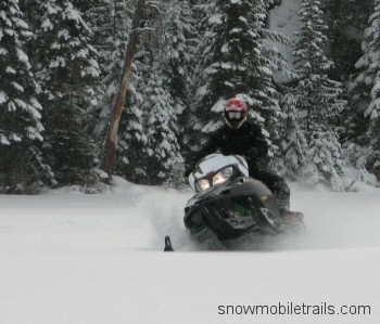 Snowmobiling in powder Plummes Lake, Ontario
